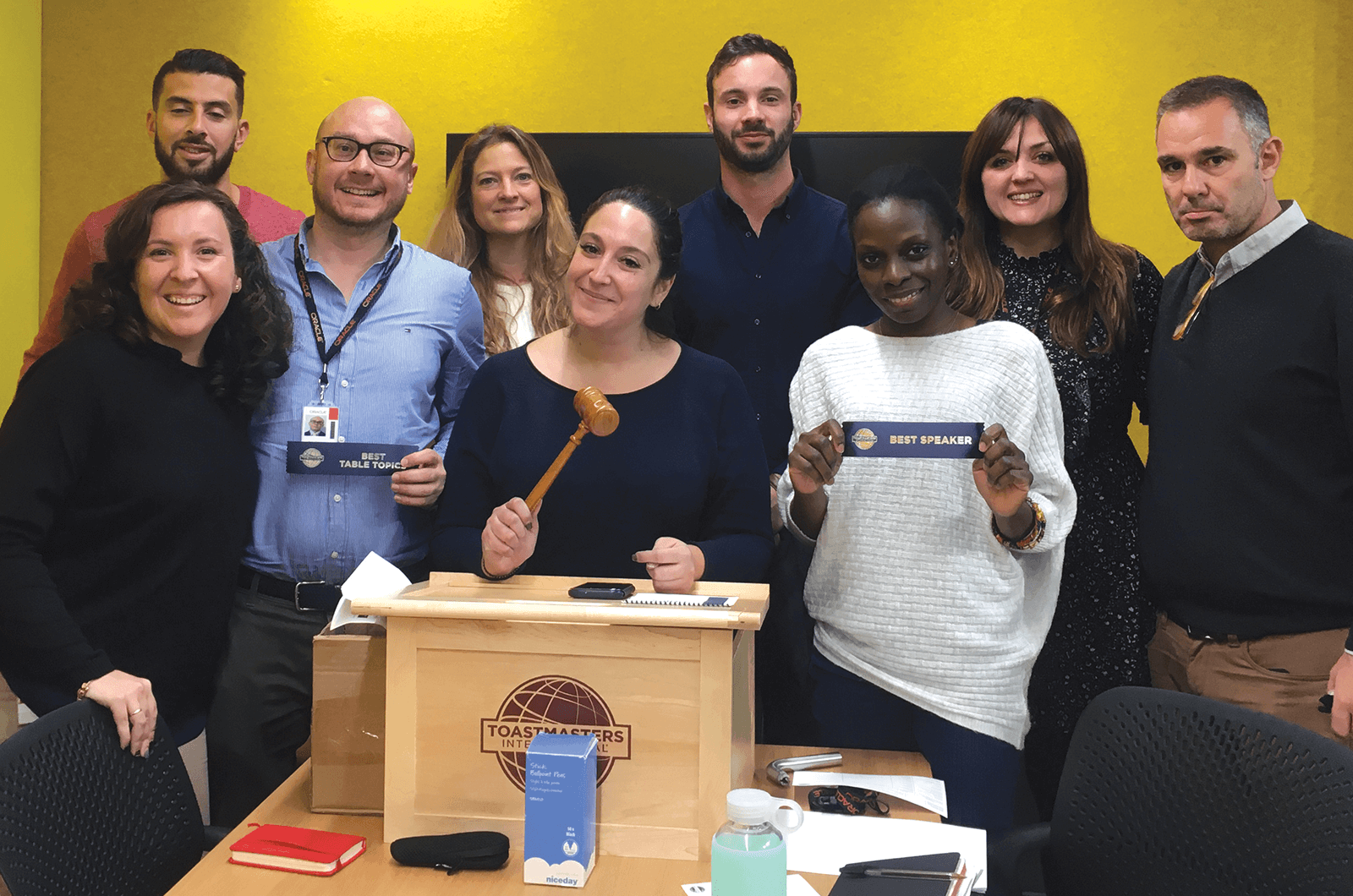 Group of Toastmasters with lectern and gavel
